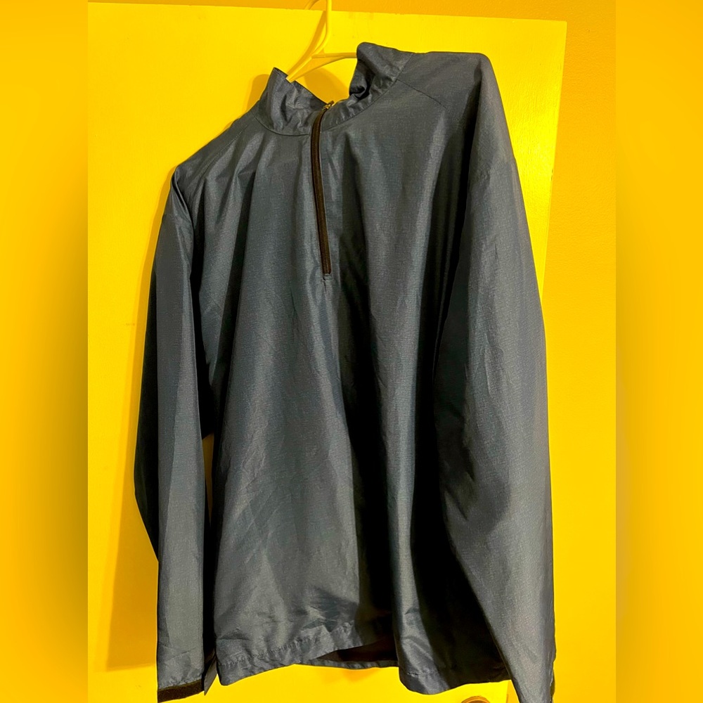 Quarter zip rain repellant golf pullover by PGA Tour